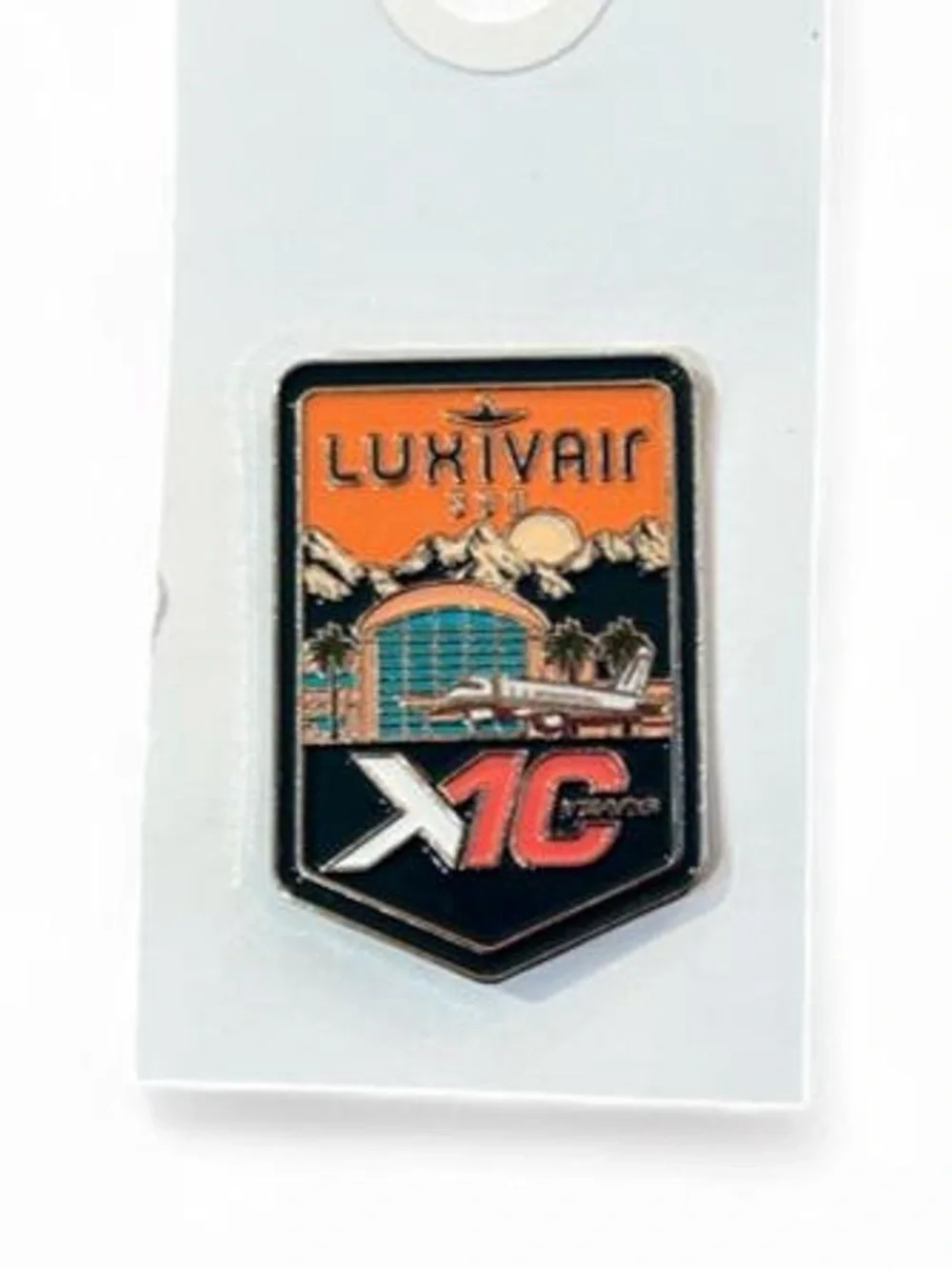 Vintage LUXIVAIR X1C Enamel Pin - Orange and Black Travel Badge